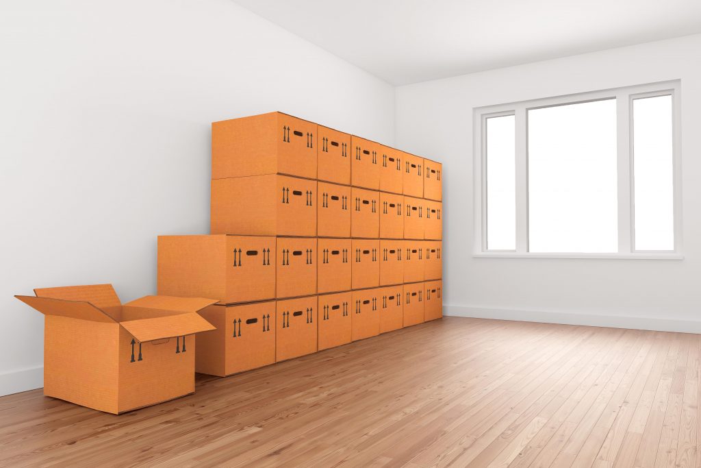 Clean and tidy spare room with storage boxes